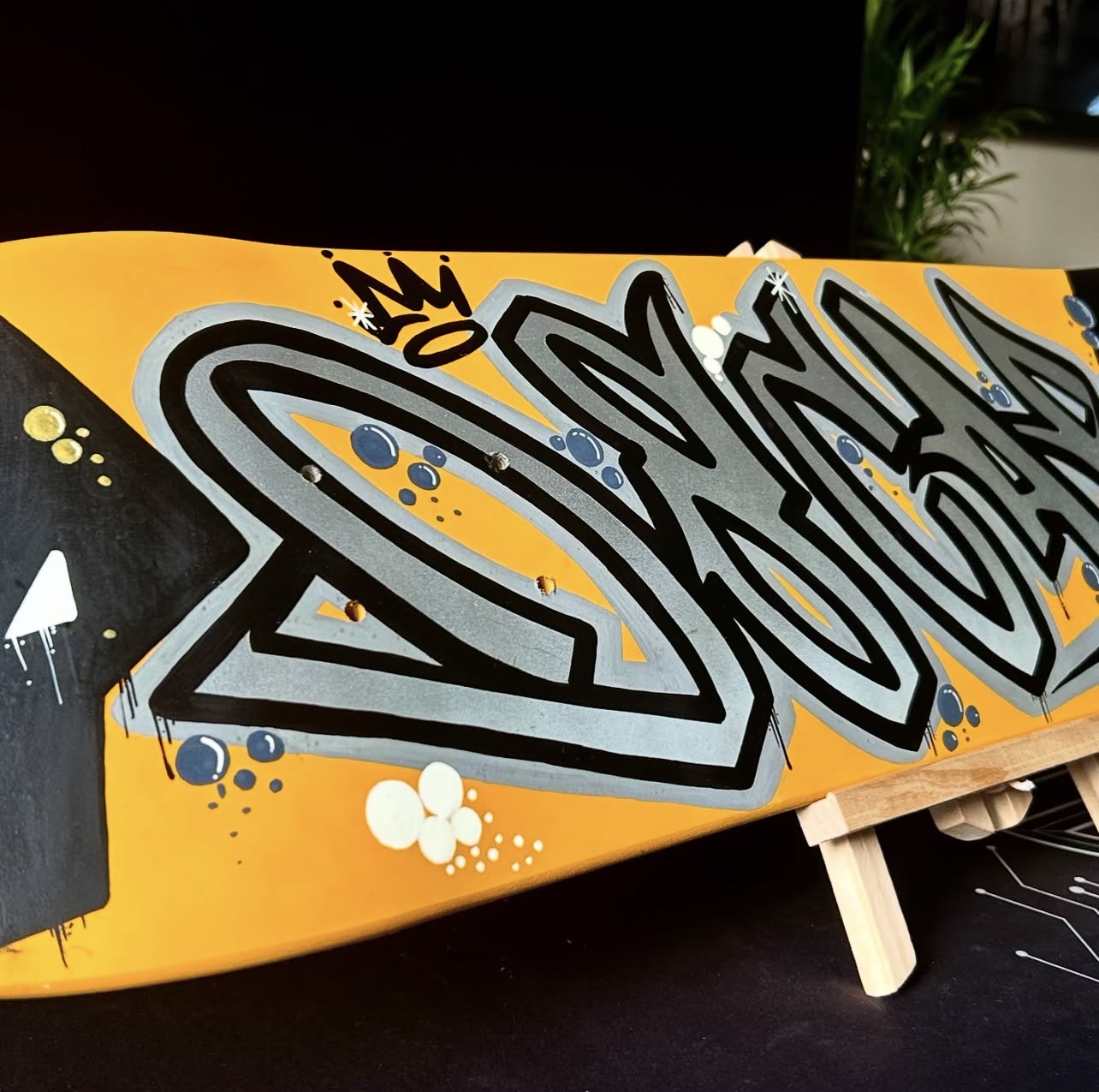 Orange and silver graffiti custom skateboard