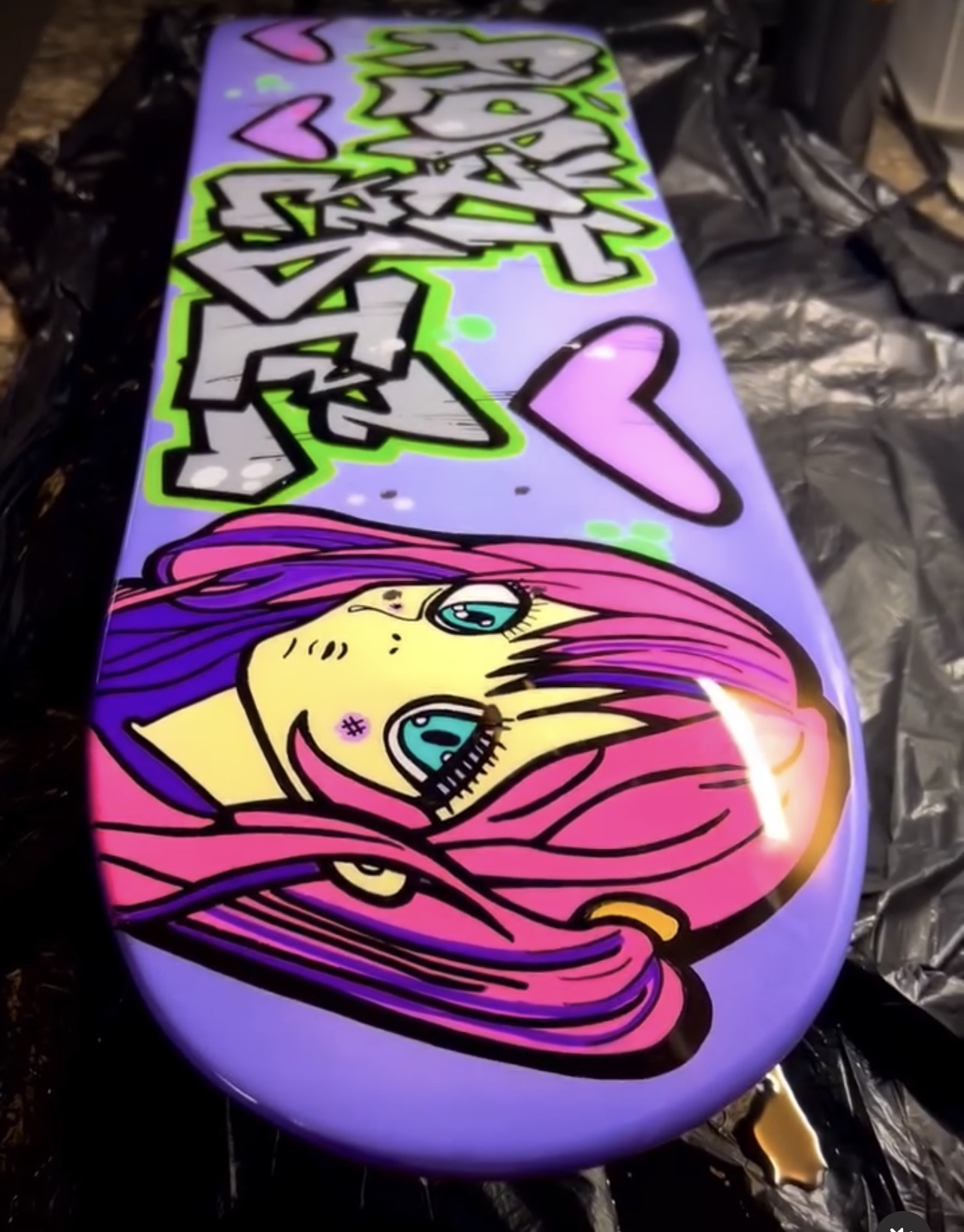 Purple graffiti girl custom skateboard