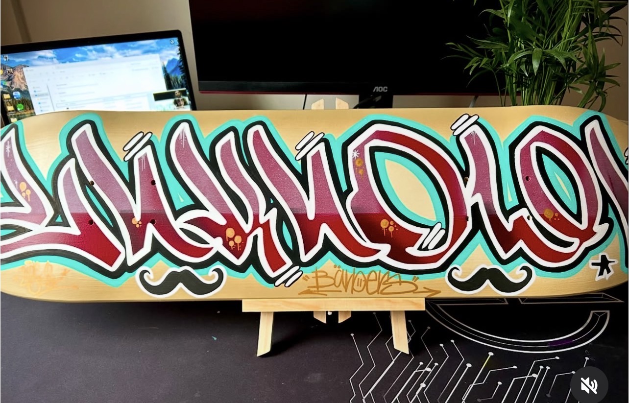 Red and gold graffiti skateboard