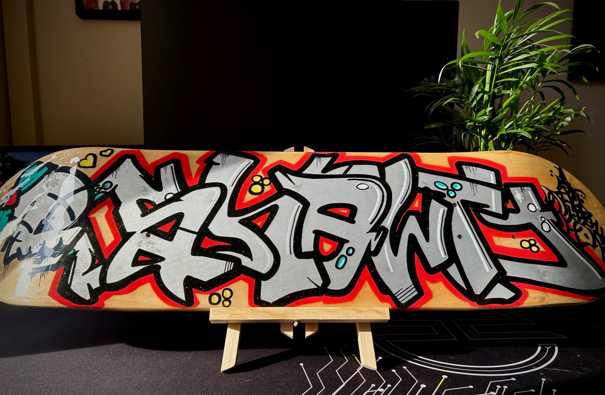 Red and silver graffiti custom skateboard